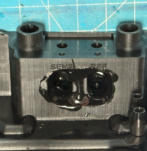 Plastic glue to create airtight channels.png